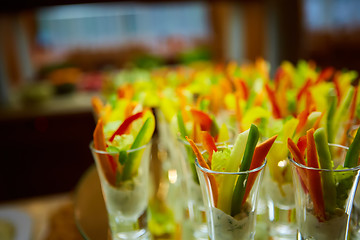 Image showing Colorful slices of raw vegetables in glasses