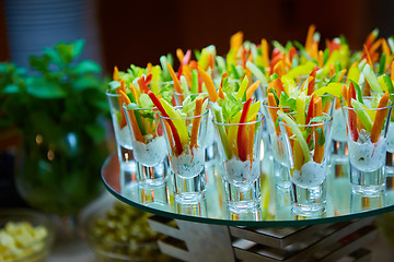 Image showing Colorful slices of raw vegetables in glasses