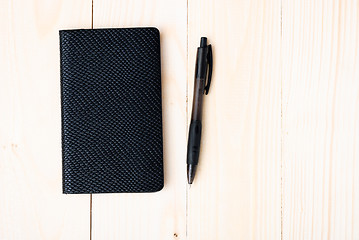 Image showing Small notepad with pen