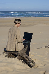 Image showing Working at the beach