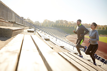 Image showing couple running upstairs on stadium