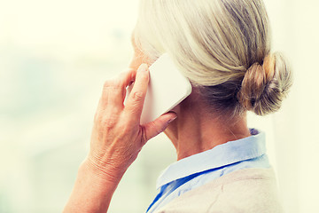 Image showing close up of senior woman calling on smartphone