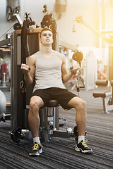 Image showing man exercising on gym machine