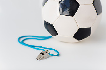 Image showing close up of football or soccer ball and whistle