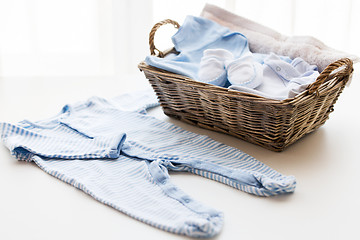 Image showing close up of baby clothes for newborn boy in basket