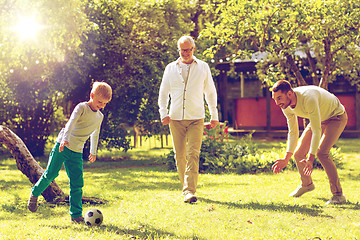 Image showing happy family playing football outdoors