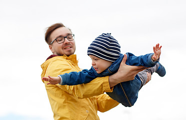 Image showing father with son playing and having fun outdoors