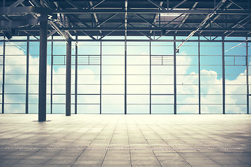 Image showing airport terminal room over blue sky and clouds