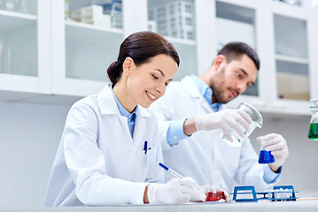 Image showing young scientists making test or research in lab