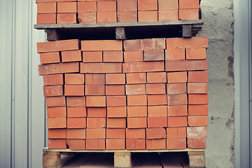 Image showing brown bricks batch on wooden storage tray