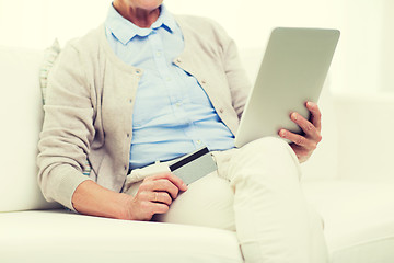 Image showing senior woman with tablet pc and credit card