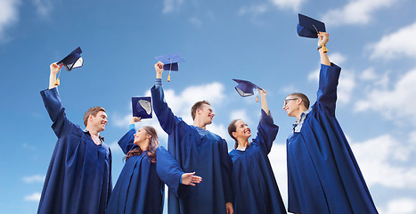 Image showing group of smiling students with mortarboards