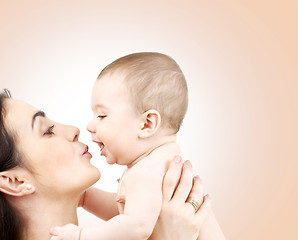 Image showing happy mother kissing adorable baby