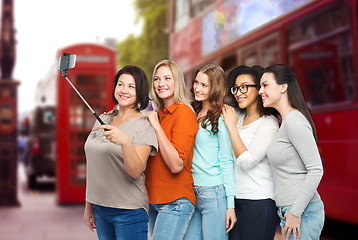 Image showing happy women taking selfie by smartphone in london