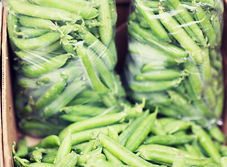 Image showing close up of green peas in box at street market