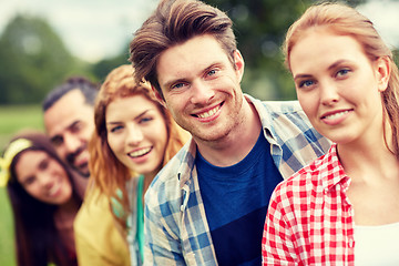 Image showing group of smiling friends outdoors