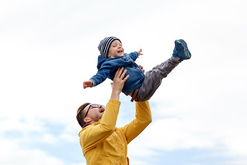 Image showing father with son playing and having fun outdoors