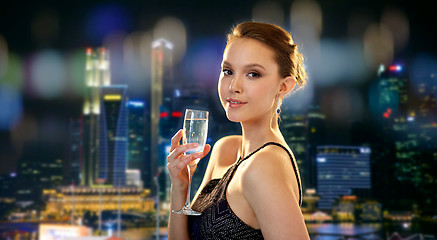 Image showing young asian woman drinking champagne at party