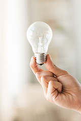 Image showing close up of hand holding edison lamp or lightbulb