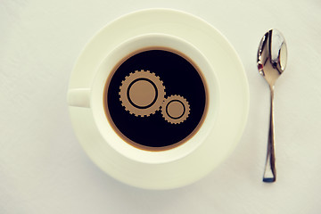 Image showing cup of coffee with cogwheel symbol and spoon