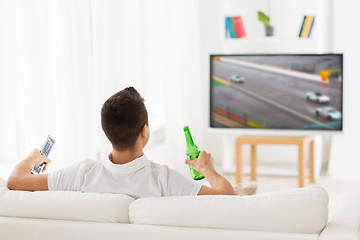 Image showing man watching tv and drinking beer at home