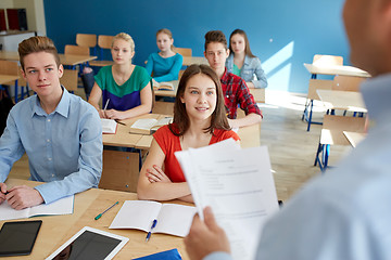 Image showing group of students and teacher with papers or tests