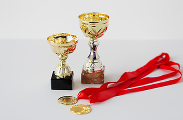 Image showing close up of sports golden cups and medals