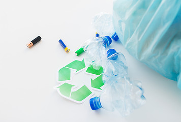 Image showing close up of used bottles and batteries recycling