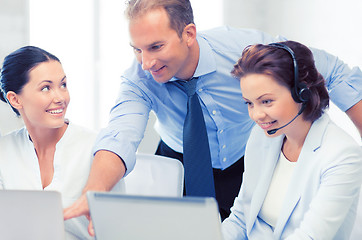 Image showing group of people working in call center