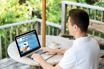 Image showing close up of businessman with laptop on terrace