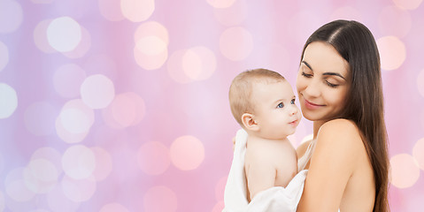 Image showing happy mother holding adorable baby