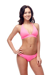 Image showing happy young woman in pink bikini swimsuit