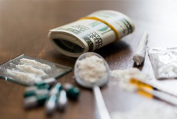 Image showing close up of drugs, money, spoon and syringe