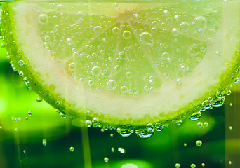 Image showing lemon in sparcle water drops