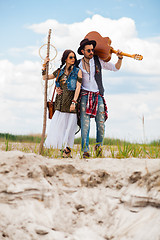 Image showing Man and woman as boho hipsters against blue sky