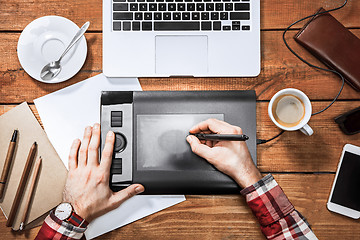 Image showing Graphic Designer working with interactive pen display, digital Drawing tablet and Pen on a computer