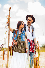 Image showing Man and woman as boho hipsters against blue sky