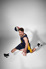 Image showing Full length portrait of a basketball player with ball