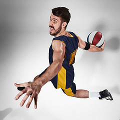 Image showing Full length portrait of a basketball player with ball