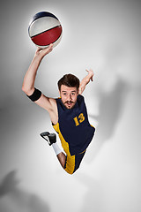 Image showing Full length portrait of a basketball player with ball