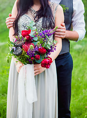 Image showing The crop image of romantic couple with flowers