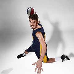 Image showing Full length portrait of a basketball player with ball