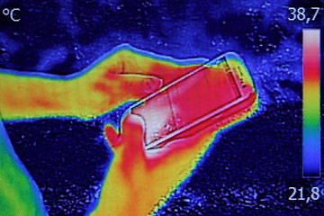 Image showing Infrared image showing the heat emission when Young girl used sm