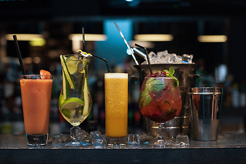 Image showing cocktails on bar background