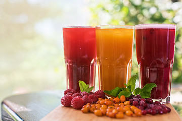 Image showing fruit drink with cranberries raspberries and sea buckthorn