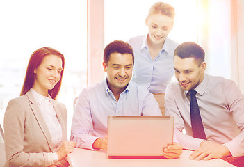 Image showing business team working with laptop in office