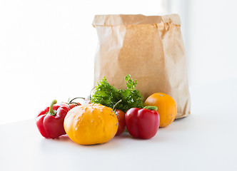 Image showing close up of paper bag with vegetables at kitchen