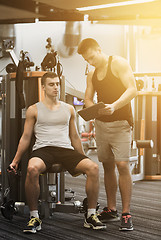 Image showing man exercising on gym machine