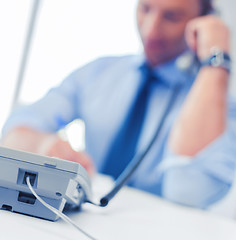 Image showing handsome businessman talking on the phone