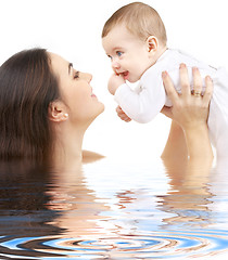 Image showing happy mother with baby boy in water #2